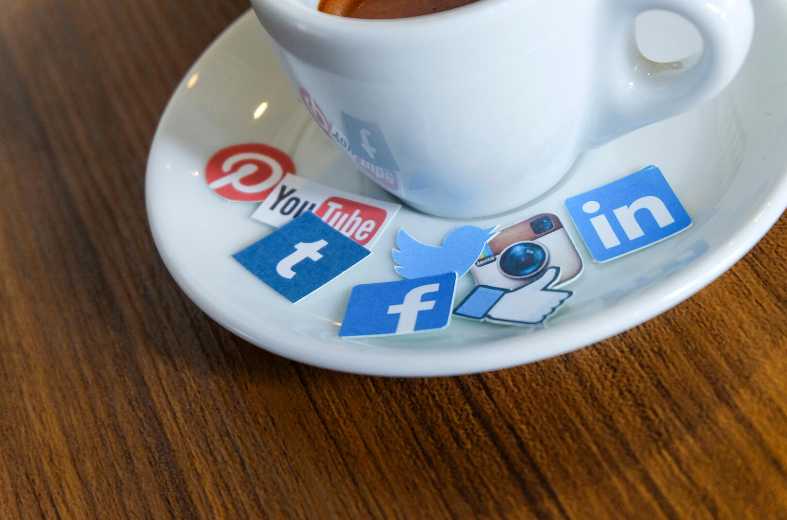 Social media icons on a coffee plate